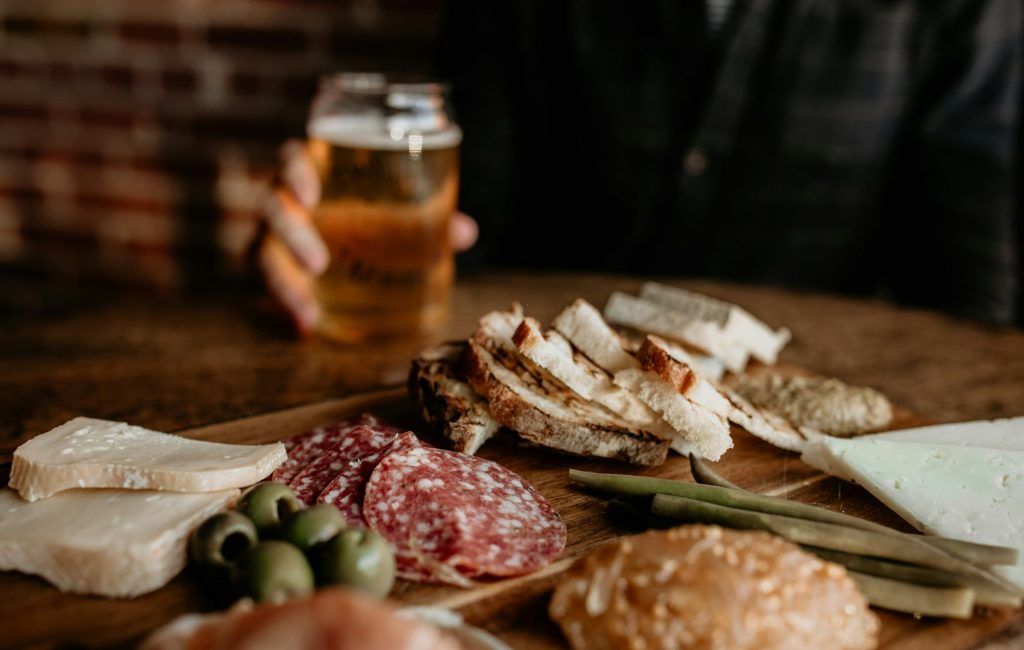 a wooden table topped with lots of different types of food